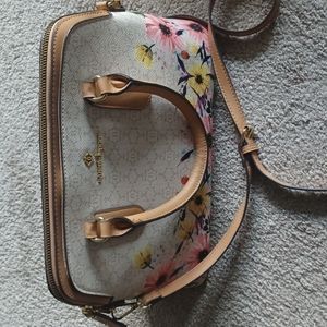 Nanette Lepore bag,  Cream and tan with various flowers. Yellow pink, purple, bl